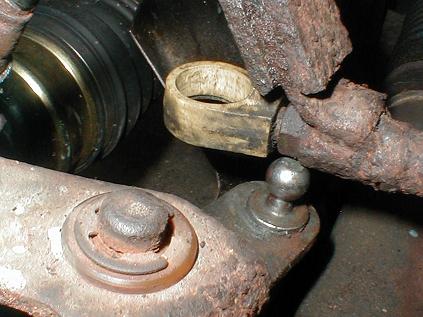 Close up of ball on shifter linkage and nylon end on shifter tube